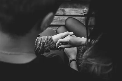 Couple holding hands seen from behind